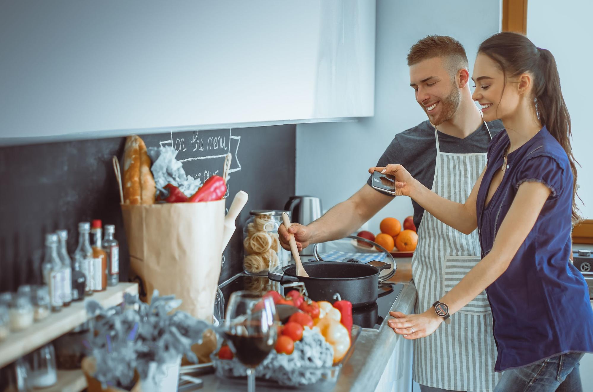 young couple cooking